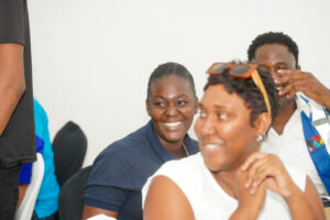 Three people smiling